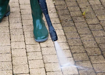 1654750016125_a-man-pressure-washing-a-driveway